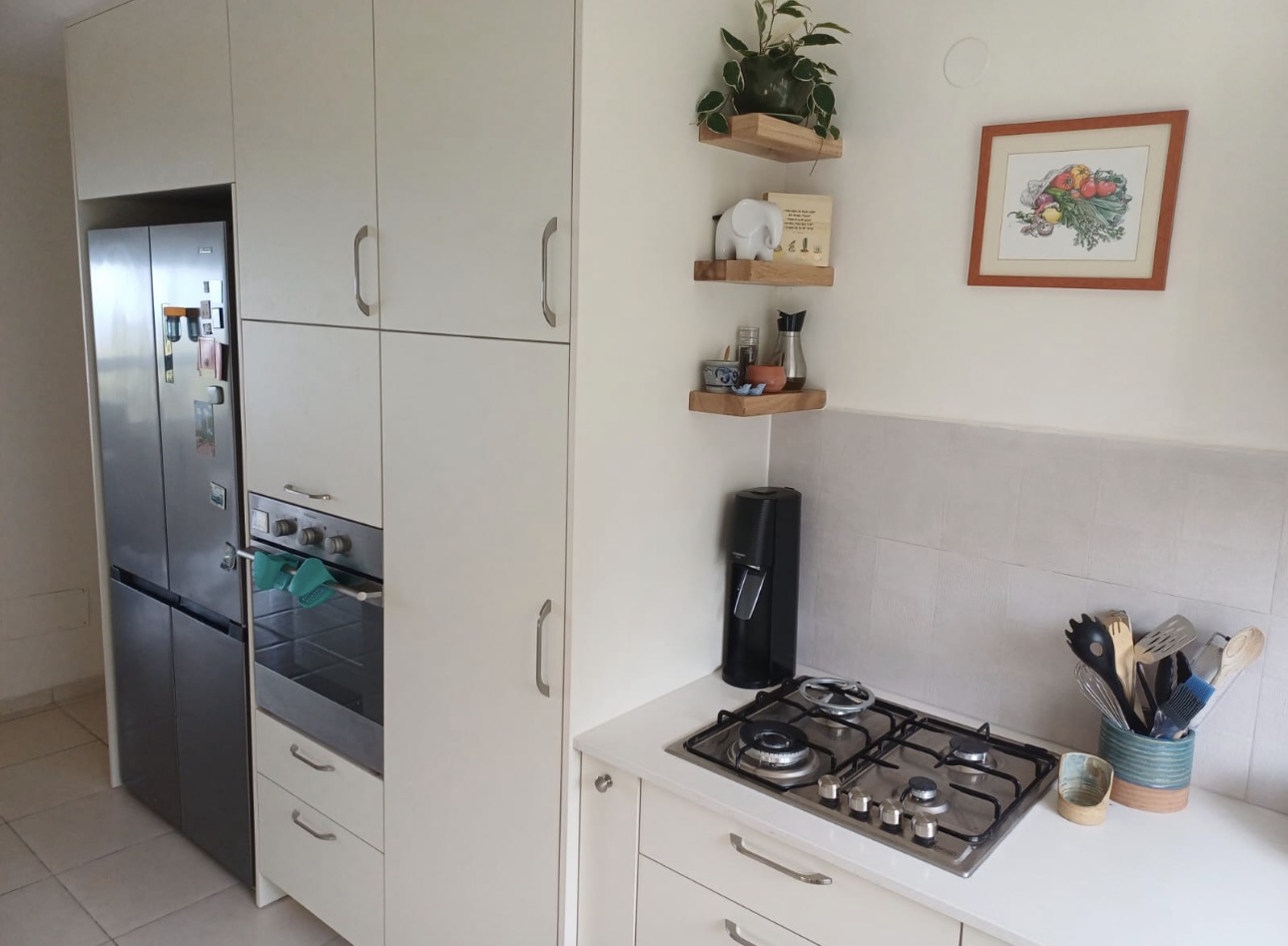 New kitchen — prep run with cooktop, drawers and floating shelves