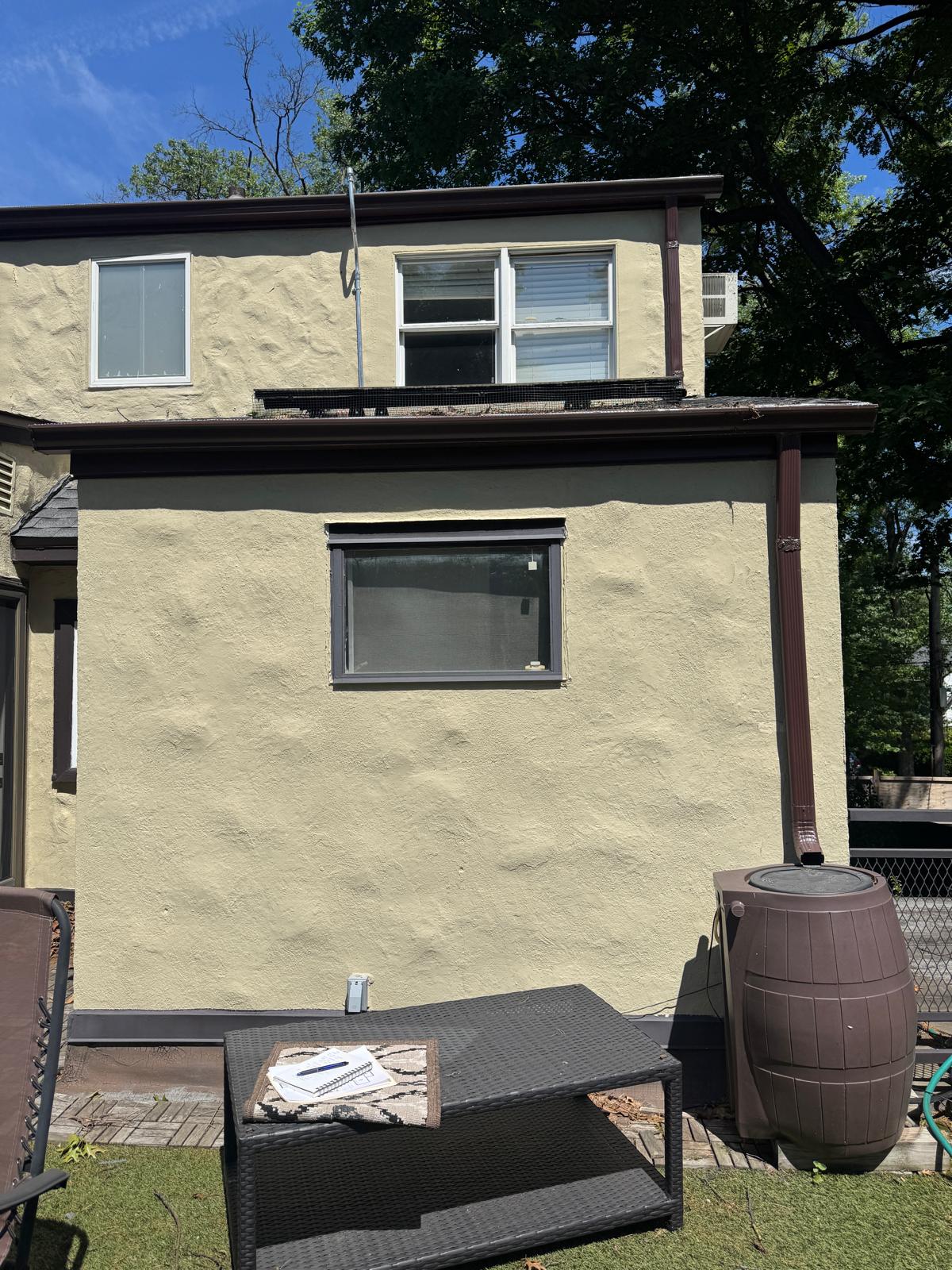 Exterior view of the second-floor rear wall where the balcony and bedroom sit
