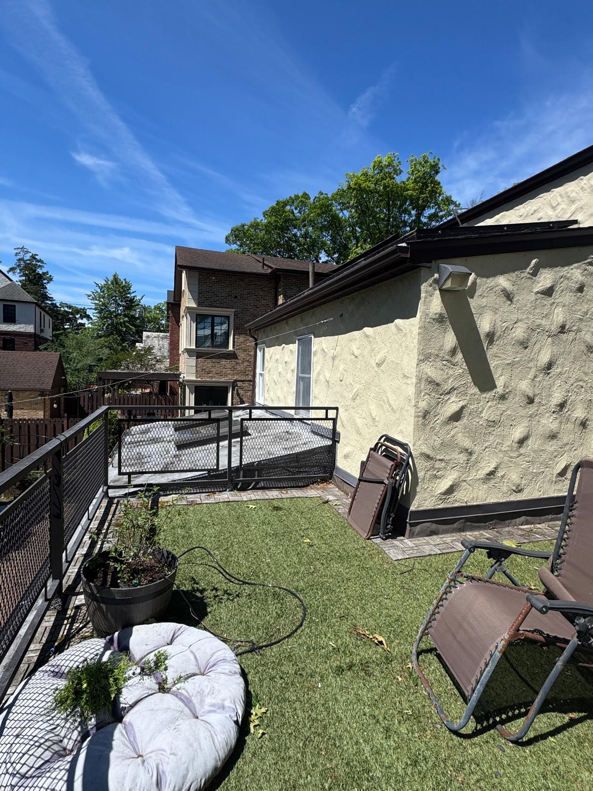 Existing balcony off the primary suite — underused outdoor space to be enclosed